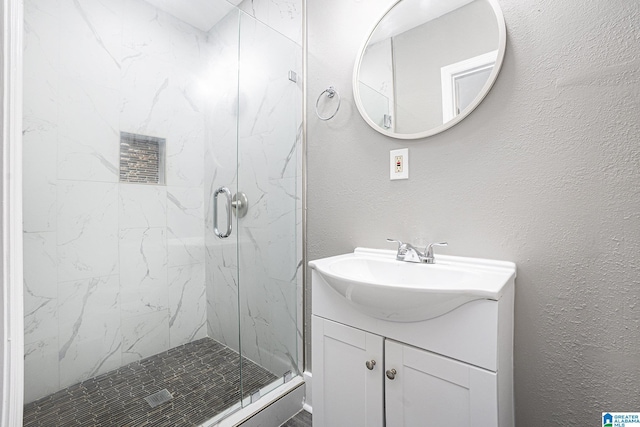 bathroom with vanity and an enclosed shower