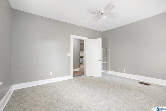 unfurnished bedroom featuring carpet floors and ceiling fan