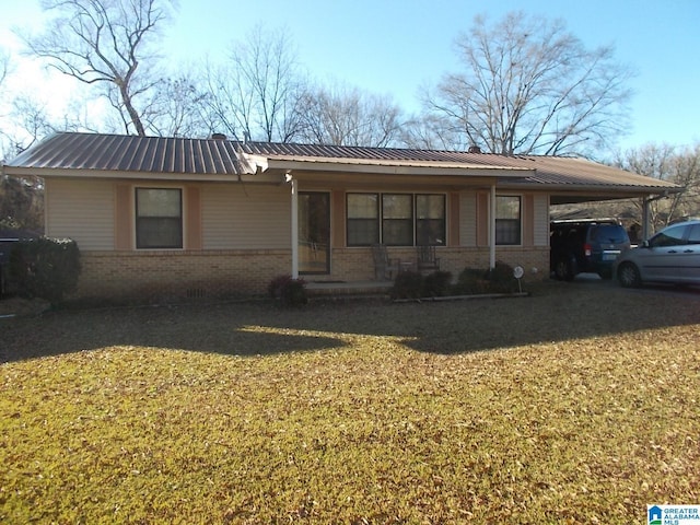 single story home with a carport and a front lawn