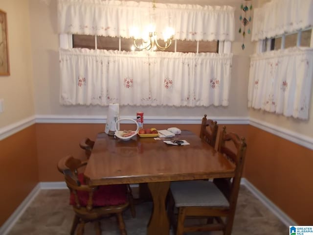 dining area with a notable chandelier