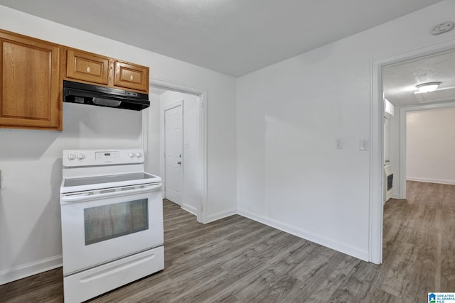 kitchen with white electric range oven and light wood-type flooring