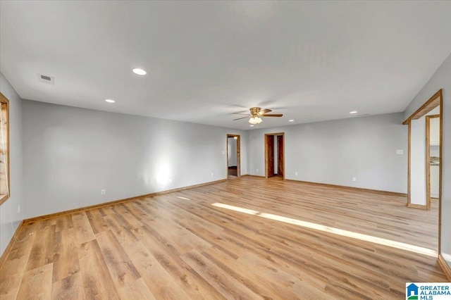 empty room featuring light wood-type flooring and ceiling fan