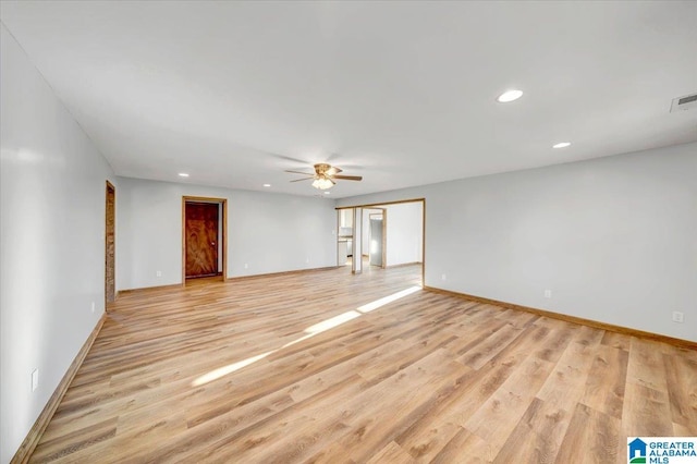 unfurnished room with light hardwood / wood-style floors and ceiling fan