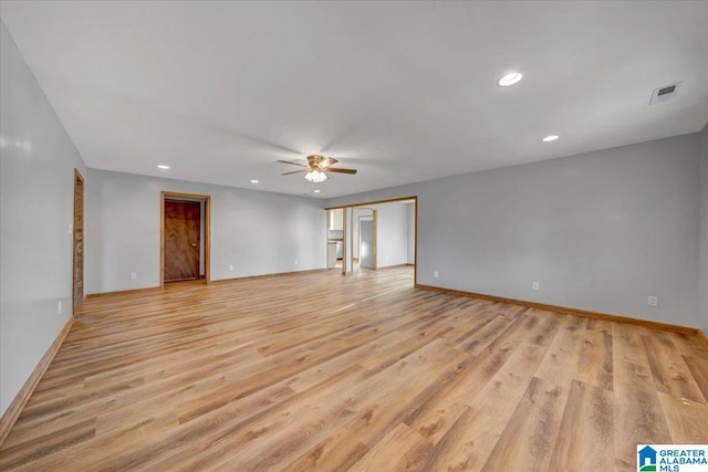 spare room with ceiling fan and light hardwood / wood-style flooring