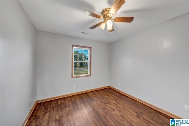 spare room featuring hardwood / wood-style flooring and ceiling fan