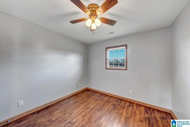 empty room with wood-type flooring and ceiling fan