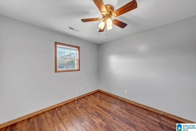 empty room with ceiling fan and wood-type flooring