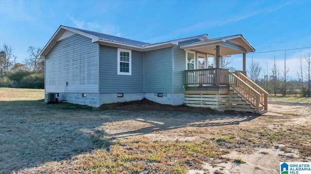 exterior space featuring central AC and a porch