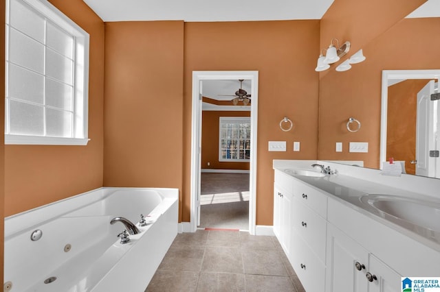 bathroom featuring a tub, ceiling fan, and plenty of natural light