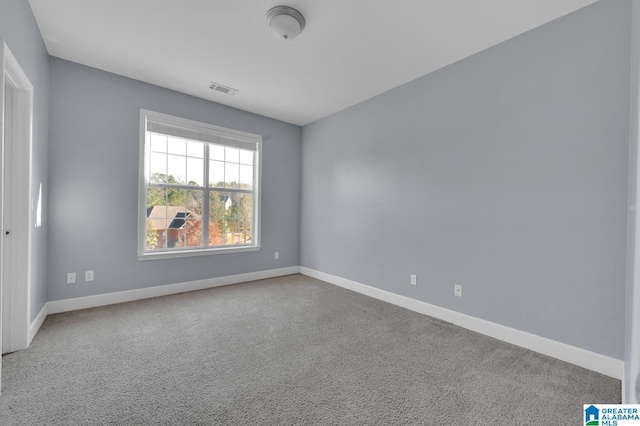 empty room with carpet flooring