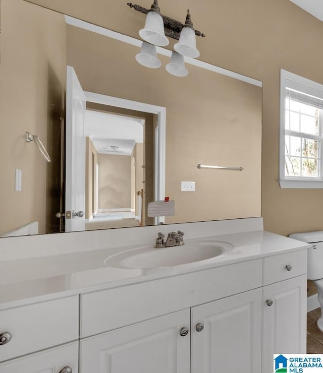 bathroom with vanity and toilet