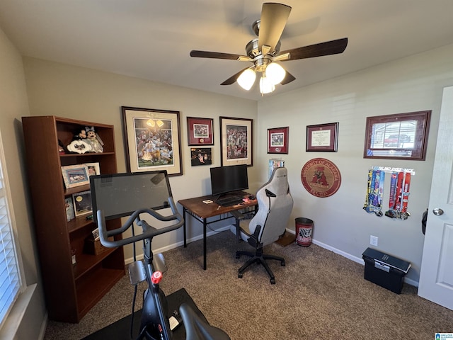 carpeted office featuring ceiling fan