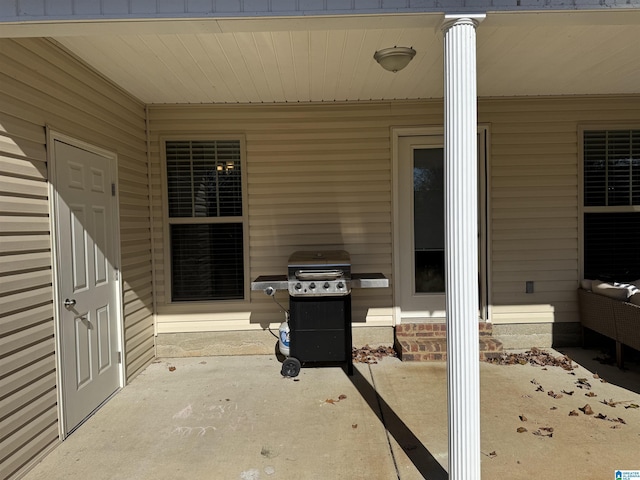 view of patio featuring a grill