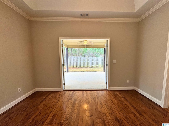 interior space with dark hardwood / wood-style floors and ornamental molding