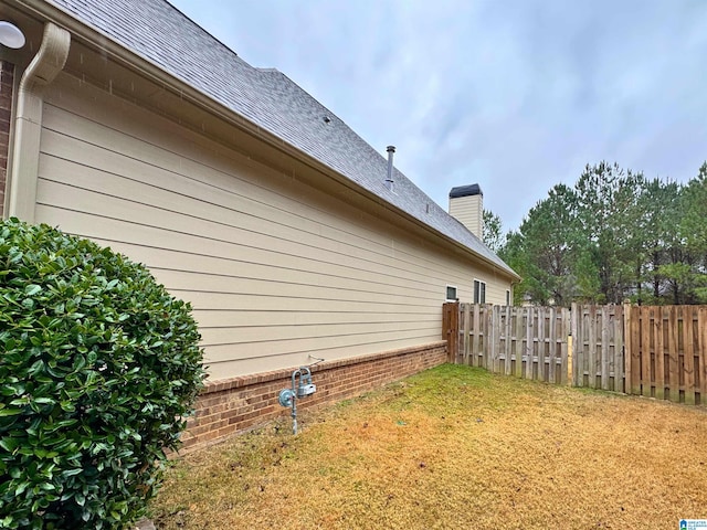 view of property exterior with a lawn