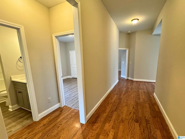 corridor featuring dark wood-type flooring