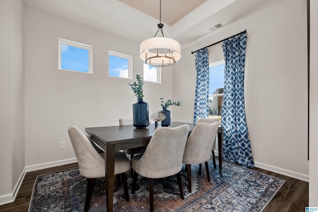 dining room with dark hardwood / wood-style floors