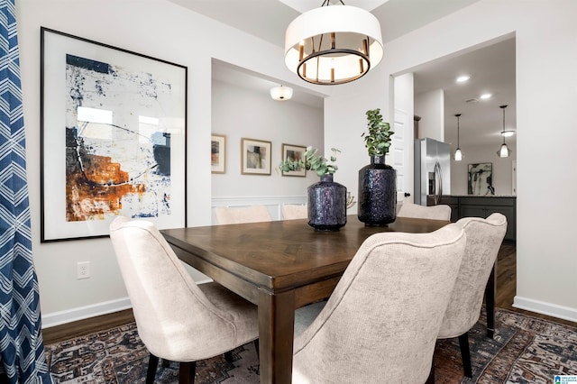 dining room with dark wood-type flooring