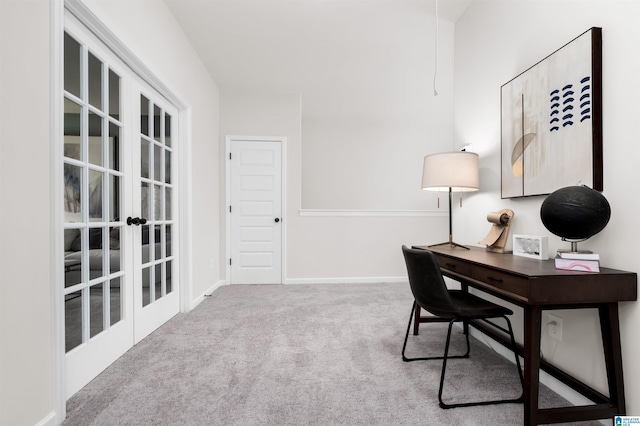 carpeted office with french doors