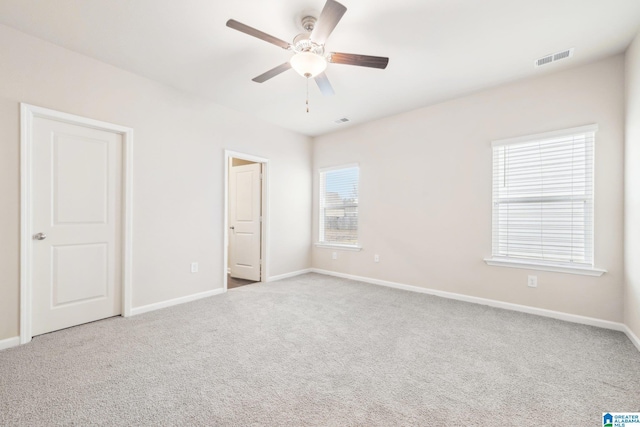 unfurnished bedroom featuring ceiling fan and light carpet