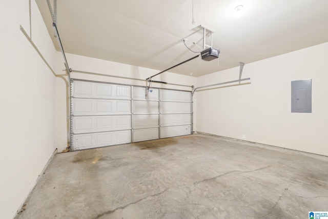 garage with electric panel and a garage door opener