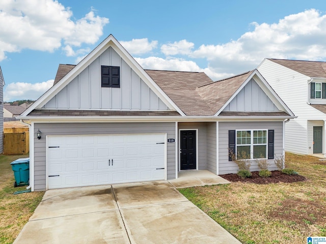 view of front of property featuring a garage and a front lawn