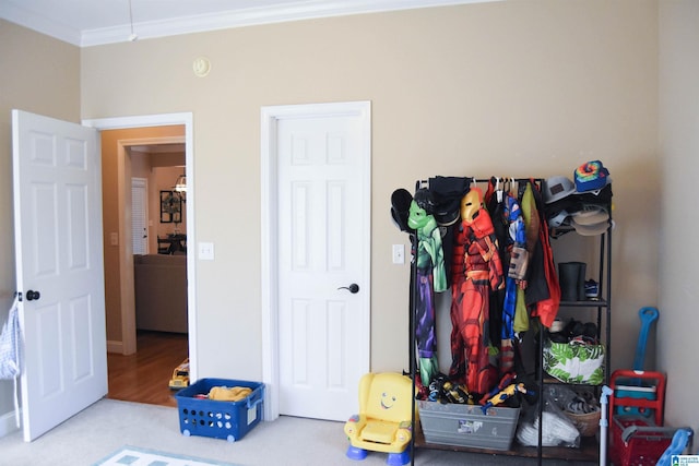 bedroom featuring carpet floors and ornamental molding