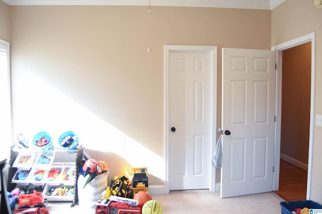 game room featuring light colored carpet