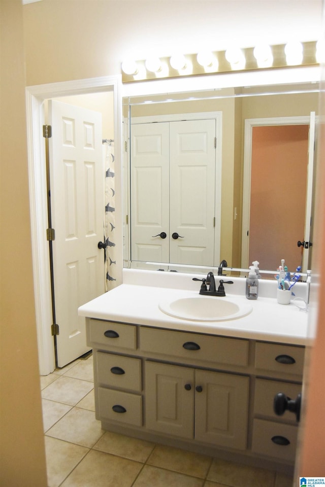 bathroom with tile patterned flooring and vanity