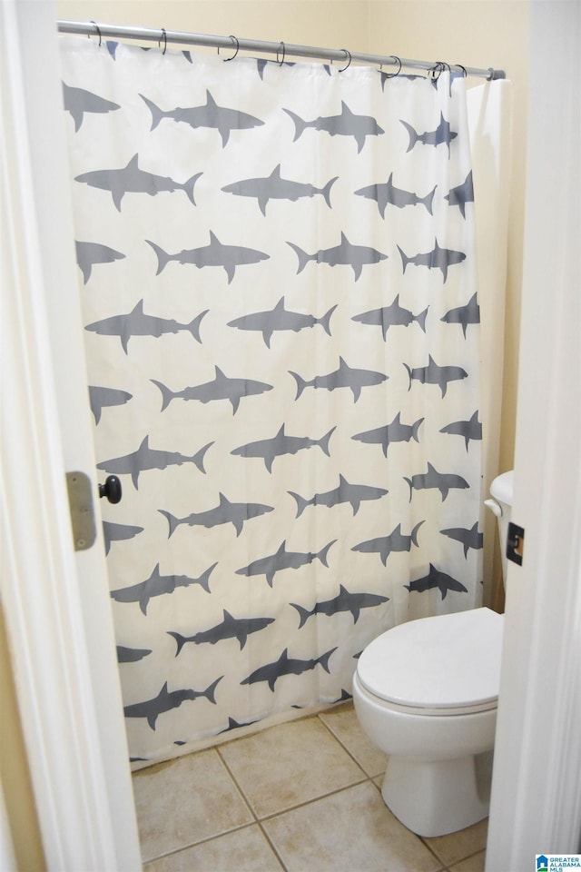 bathroom featuring tile patterned flooring and toilet