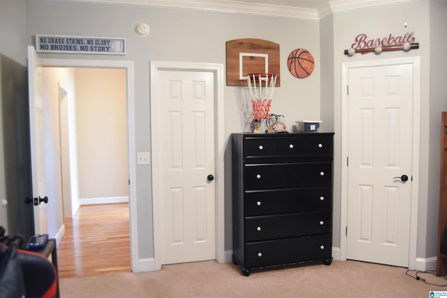 carpeted bedroom with ornamental molding