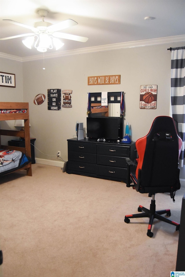 carpeted office space featuring ceiling fan and crown molding