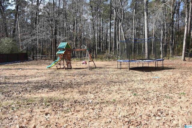 view of jungle gym with a trampoline