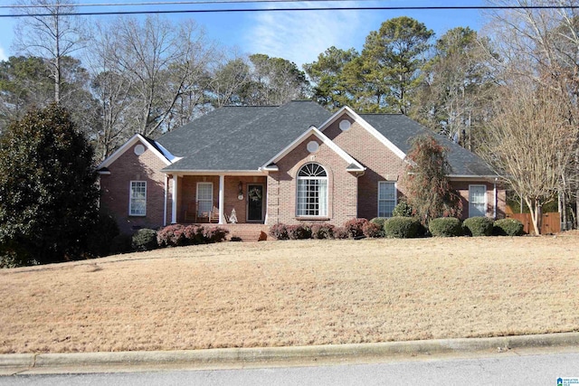 view of front of house featuring a front lawn and a porch