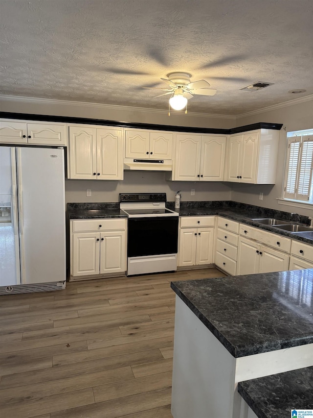 kitchen featuring white cabinets, white fridge with ice dispenser, electric stove, and crown molding