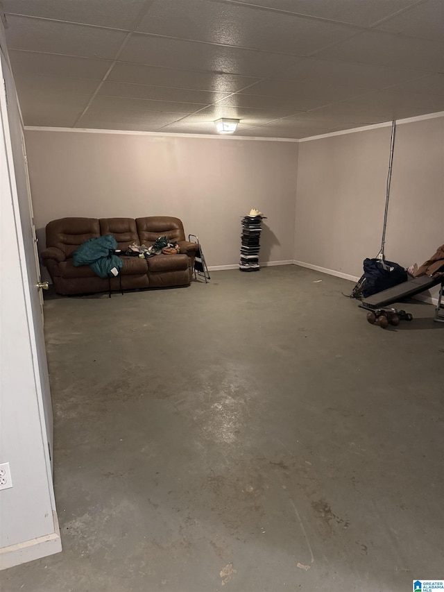 basement with a paneled ceiling