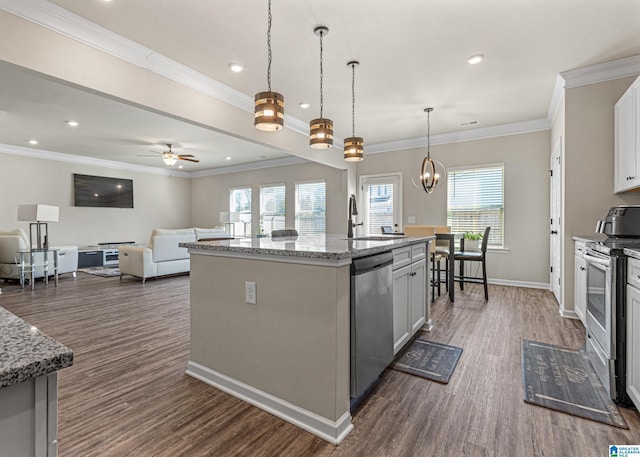 kitchen featuring white cabinetry, an island with sink, stainless steel appliances, and light stone counters