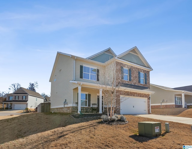 craftsman inspired home featuring a garage and a front yard