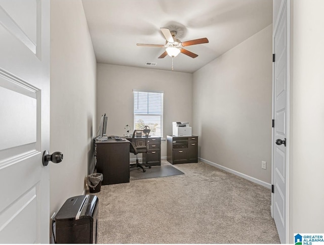 carpeted office with ceiling fan