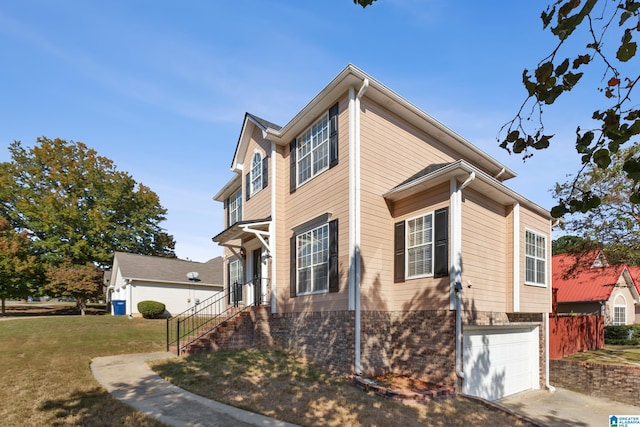 view of front of home featuring a garage and a front lawn