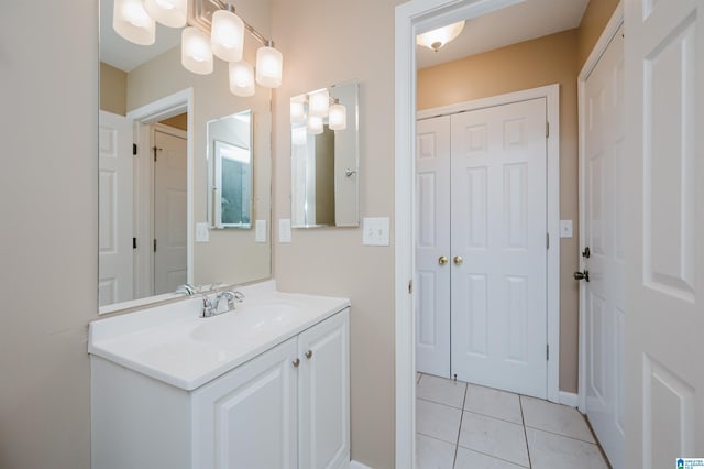 bathroom with tile patterned flooring and vanity