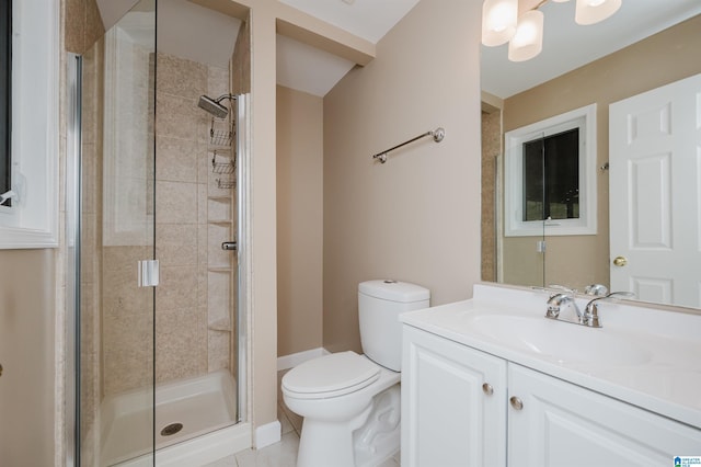 bathroom with tile patterned floors, vanity, toilet, and a shower with door