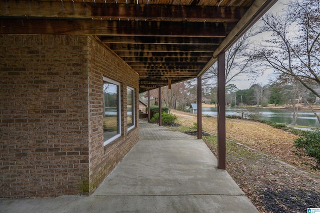 view of patio with a water view