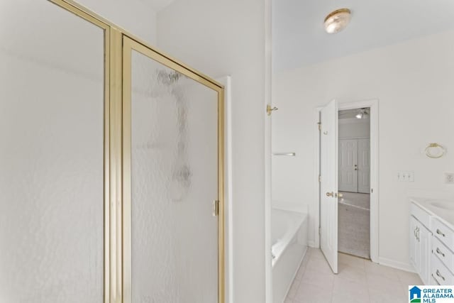 bathroom featuring vanity and separate shower and tub