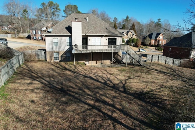 back of property with a deck