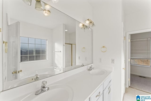 bathroom featuring a wealth of natural light, tile patterned flooring, vanity, and shower with separate bathtub