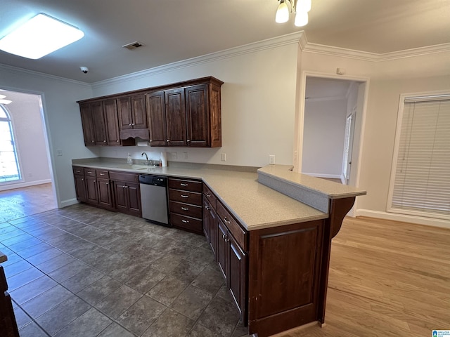 kitchen with dishwasher, sink, kitchen peninsula, crown molding, and dark brown cabinetry