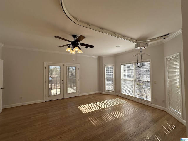 unfurnished room featuring crown molding, french doors, ceiling fan, and hardwood / wood-style floors