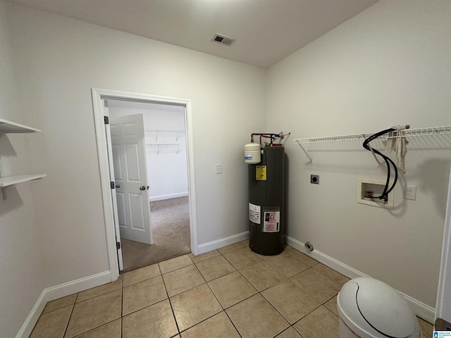 utility room featuring water heater