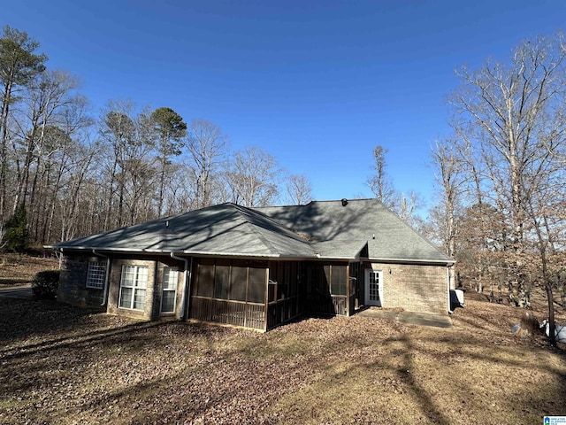 view of home's exterior featuring a sunroom